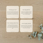 The Negotiations: four coasters on an oak table, The Blue Cup, The Drawing, Two More Minutes and One More Book